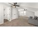 Upstairs bonus room with a couch, doors to bedrooms and bathrooms, and neutral walls at 3723 Silvery Way, Powder Springs, GA 30127