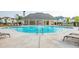 Sparkling community pool with lounge chairs and a covered area for relaxation and social gatherings at 3723 Silvery Way, Powder Springs, GA 30127