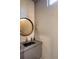 Contemporary bathroom with a round mirror, modern fixtures, and a stylish vanity at 721 Longleaf Ne Dr # 3, Atlanta, GA 30342