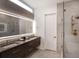 Modern bathroom with double vanity, sleek shower, and stylish fixtures with neutral color palette at 721 Longleaf Ne Dr # 3, Atlanta, GA 30342