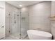 Elegant bathroom featuring a modern glass shower, soaking tub, and stylish tile work at 721 Longleaf Ne Dr # 3, Atlanta, GA 30342