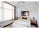 Cozy bedroom with soft lighting, neutral tones, and a comfortable bed with a bench at 721 Longleaf Ne Dr # 3, Atlanta, GA 30342