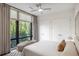 Bright bedroom featuring a large window with tree views and a cozy seating area at 721 Longleaf Ne Dr # 3, Atlanta, GA 30342