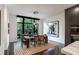 Modern dining room with a large window providing natural light, hardwood floors and contemporary furnishings at 721 Longleaf Ne Dr # 3, Atlanta, GA 30342