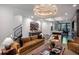 Spacious living room with hardwood floors and contemporary furnishings, leading into the modern kitchen at 721 Longleaf Ne Dr # 3, Atlanta, GA 30342