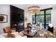 An interior shot reveals a modern living room with a fireplace, plush seating, and a large window at 721 Longleaf Ne Dr # 3, Atlanta, GA 30342