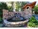 Grand Estates entrance with stone fountain, lush landscaping, and distinguished signage at 9675 Almaviva Dr, Alpharetta, GA 30022