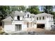 New construction featuring an exterior elevation with white painted brick and a light grey roof at 9675 Almaviva Dr, Alpharetta, GA 30022