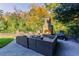 Outdoor patio with a fireplace and comfortable seating, perfect for entertaining at 9675 Almaviva Dr, Alpharetta, GA 30022