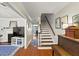 Inviting foyer with hardwood floors, staircase, and access to the living room and dining area at 62 Mount Vernon Cir, Atlanta, GA 30338