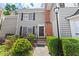 Charming two-story townhouse featuring a brick accent, well-maintained landscaping and a cozy front entrance at 62 Mount Vernon Cir, Atlanta, GA 30338