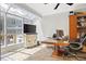 Sunroom featuring a glass ceiling, tile floor, and plenty of natural light, perfect for an office at 62 Mount Vernon Cir, Atlanta, GA 30338