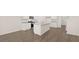 Bright kitchen featuring white cabinetry, a center island with granite countertops, and stainless steel appliances at 8605 Secretariat Dr, Lithonia, GA 30058