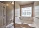 Bathroom features a large white tub and tile accents at 1282 Berryhill Dr, Lithonia, GA 30058