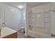 Bathroom features patterned tile, single sink vanity and bathtub at 1282 Berryhill Dr, Lithonia, GA 30058