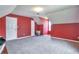 Bedroom with red walls, white trim, and a closet at 1282 Berryhill Dr, Lithonia, GA 30058