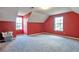 Bedroom with red walls, two windows, and neutral carpet at 1282 Berryhill Dr, Lithonia, GA 30058