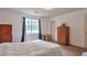 Bedroom with carpet, large window and wood colored wardrobe at 1282 Berryhill Dr, Lithonia, GA 30058