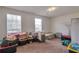 Spacious bonus room with carpet and two windows at 1282 Berryhill Dr, Lithonia, GA 30058