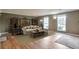 Bright and airy living room with two windows, a cozy couch, and stylish decor at 1282 Berryhill Dr, Lithonia, GA 30058