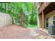 View of backyard with lush greenery and a charming stone paver path at 1996 Cobblestone Ne Cir, Atlanta, GA 30319
