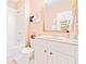 Bright bathroom with white tile, tub and vanity, complemented by a large mirror and stylish decor for a fresh feel at 1996 Cobblestone Ne Cir, Atlanta, GA 30319