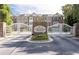 Cobblestone at Brookhaven community entrance with white gates at 1996 Cobblestone Ne Cir, Atlanta, GA 30319