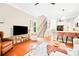 Inviting living area with hardwood floors, staircase, and an open kitchen layout, great for entertaining at 1996 Cobblestone Ne Cir, Atlanta, GA 30319