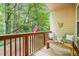 Cozy patio surrounded by lush trees, featuring comfortable seating and a patriotic touch with an American flag at 1996 Cobblestone Ne Cir, Atlanta, GA 30319