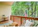 Relaxing patio with comfortable seating and view of nature, featuring string lights and an American flag at 1996 Cobblestone Ne Cir, Atlanta, GA 30319