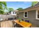 Wooden back deck with a dining set perfect for outdoor gatherings at 2486 Memorial Se Dr, Atlanta, GA 30317