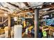 Unfinished basement with exposed ductwork, pipes, and storage space at 2486 Memorial Se Dr, Atlanta, GA 30317