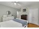A cozy bedroom with neutral walls, hardwood floors, closet, and white wood trim at 2486 Memorial Se Dr, Atlanta, GA 30317