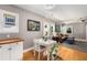 Charming dining area adjacent to the living room, featuring natural light and hardwood floors at 2486 Memorial Se Dr, Atlanta, GA 30317