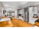 Open-concept kitchen with stainless steel appliances, wooden countertops, and hardwood flooring at 2486 Memorial Se Dr, Atlanta, GA 30317
