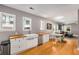 An open-concept kitchen leading into the living room featuring hardwood floors at 2486 Memorial Se Dr, Atlanta, GA 30317