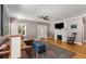 Inviting living area featuring hardwood floors, a decorative fireplace, and elegant French doors at 2486 Memorial Se Dr, Atlanta, GA 30317