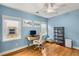 Home office featuring hardwood floors, white trim, blue walls, and natural light at 2486 Memorial Se Dr, Atlanta, GA 30317