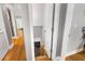 Stairwell leading to basement with hardwood floors throughout at 2486 Memorial Se Dr, Atlanta, GA 30317