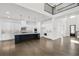 Stunning kitchen boasts a large island, stainless steel appliances, and ample white cabinetry at 6660 Wallace Farms Dr, Cumming, GA 30028