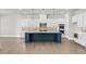 Spacious kitchen with an oversized island, stainless steel appliances and designer backsplash at 6660 Wallace Farms Dr, Cumming, GA 30028