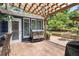Patio with grill, seating and well-manicured landscaping at 209 Hearthstone Reach, Peachtree City, GA 30269