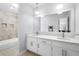 Bathroom with dual vanity and tiled shower/tub at 209 Hearthstone Reach, Peachtree City, GA 30269