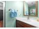 Modern bathroom vanity with framed mirror, brushed metal faucet, and towel rack at 209 Hearthstone Reach, Peachtree City, GA 30269