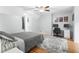 Comfortable bedroom with neutral colored walls and hardwood floors at 209 Hearthstone Reach, Peachtree City, GA 30269