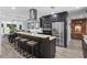 Gourmet kitchen featuring stainless steel appliances, granite countertops, and an island with bar seating at 209 Hearthstone Reach, Peachtree City, GA 30269
