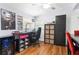 Home office featuring hardwood floors, workstation, built-in storage, and stylish decor at 209 Hearthstone Reach, Peachtree City, GA 30269