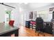 Bright office space with a desk, rolling chair, a mini fridge and built-in shelving on display at 209 Hearthstone Reach, Peachtree City, GA 30269