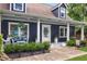Inviting front porch with comfortable seating, decorative plants, and stylish decor, perfect for relaxing at 209 Hearthstone Reach, Peachtree City, GA 30269