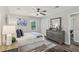 Comfortable bedroom with hardwood floors, ceiling fan, and closet at 5421 Brownlee Rd, Stone Mountain, GA 30087